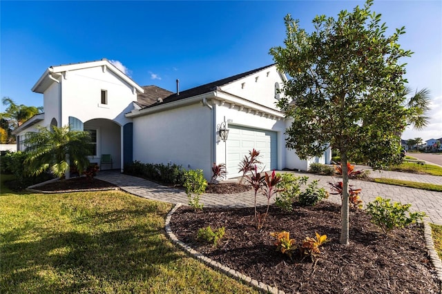 view of home's exterior with a yard and a garage