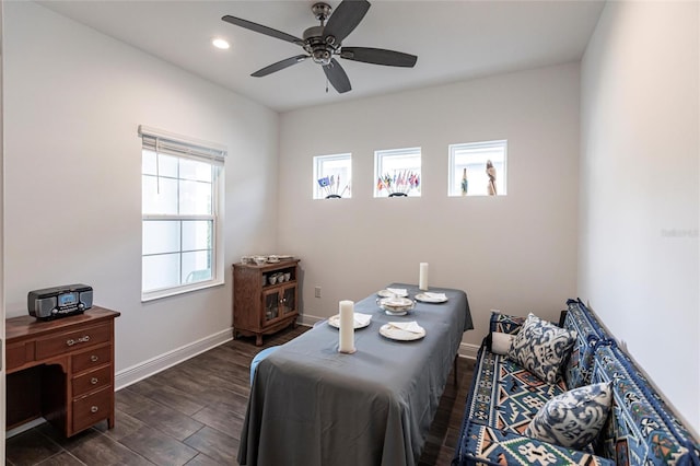 bedroom with ceiling fan and dark hardwood / wood-style floors