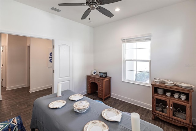 bedroom with dark hardwood / wood-style floors and ceiling fan