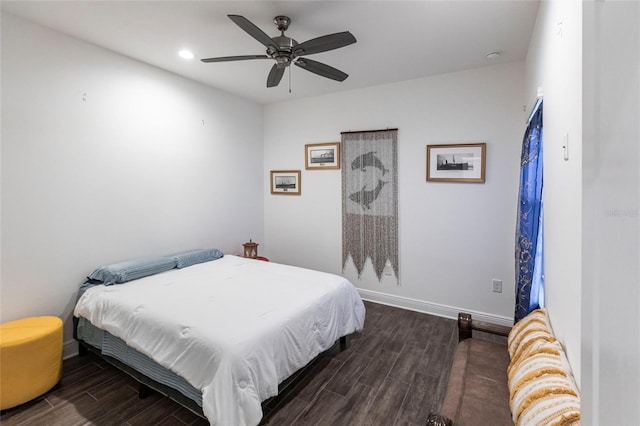 bedroom featuring ceiling fan and dark hardwood / wood-style floors