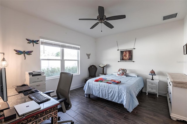 bedroom with ceiling fan and dark hardwood / wood-style floors