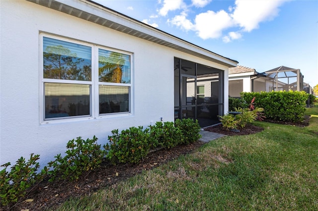 exterior space with a sunroom and a yard