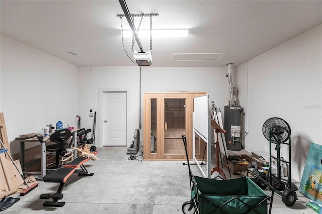 garage featuring gas water heater and a garage door opener