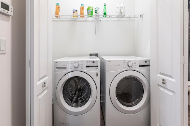 laundry room with independent washer and dryer