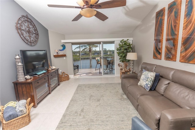 tiled living room featuring ceiling fan