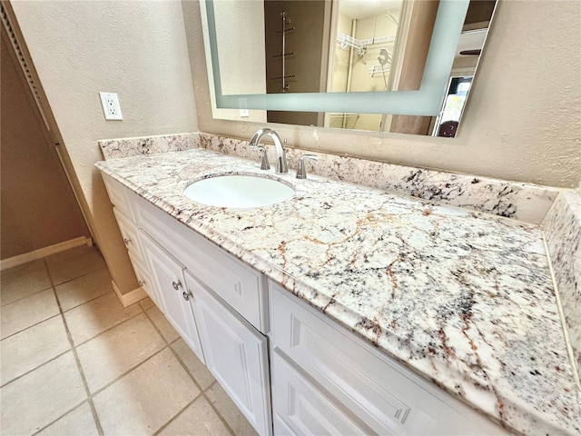 bathroom featuring tile patterned floors and vanity