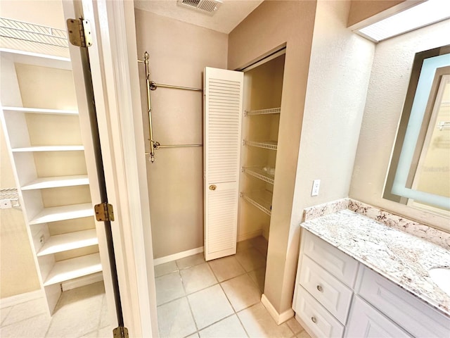 bathroom featuring vanity and tile patterned floors