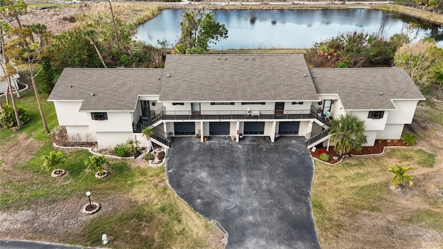 birds eye view of property with a water view