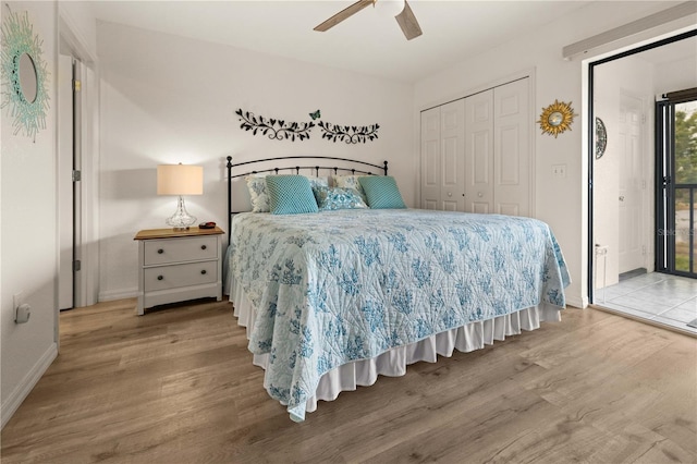 bedroom with hardwood / wood-style floors, ceiling fan, access to outside, and a closet