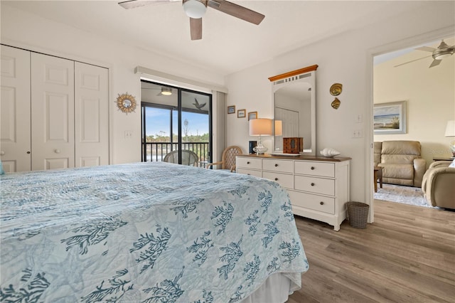 bedroom featuring access to outside, ceiling fan, a closet, and wood-type flooring