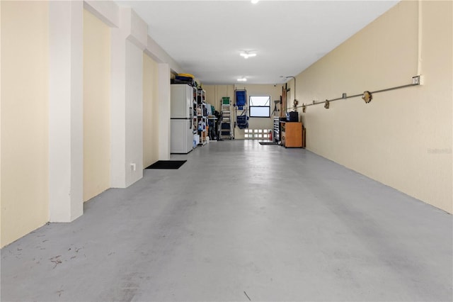 garage with white refrigerator