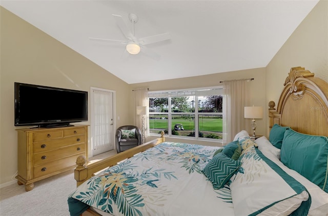 bedroom with a closet, light colored carpet, vaulted ceiling, and ceiling fan