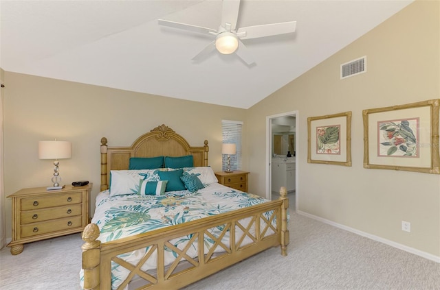 carpeted bedroom with ensuite bathroom, ceiling fan, and lofted ceiling