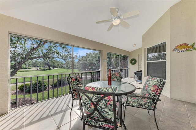 sunroom featuring ceiling fan and lofted ceiling