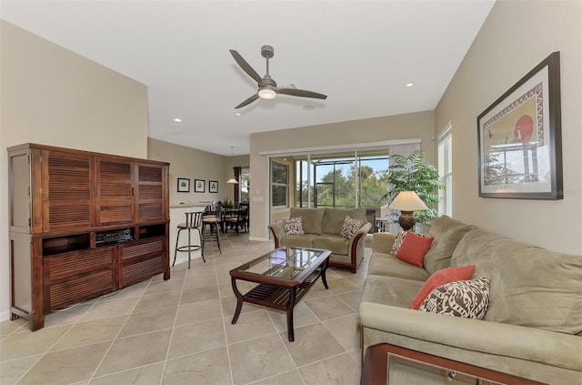 living room featuring ceiling fan and light tile patterned flooring