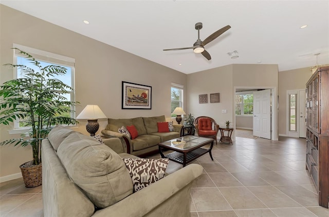 tiled living room with ceiling fan