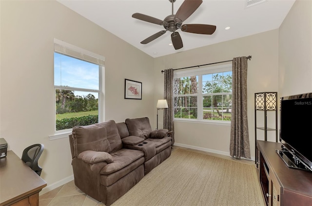 living room with ceiling fan and light tile patterned flooring