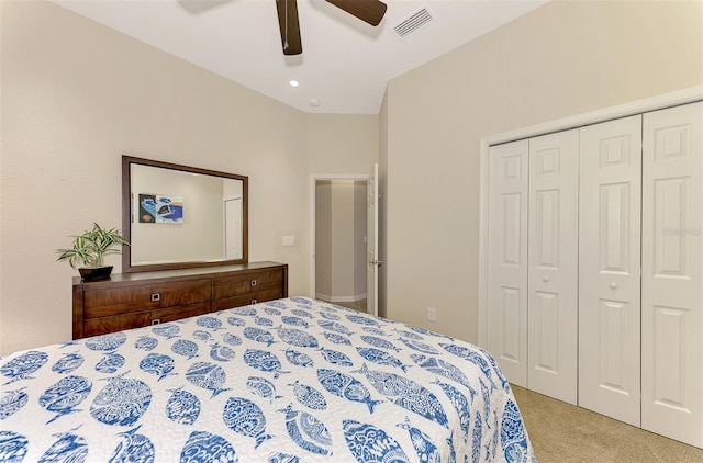 carpeted bedroom featuring ceiling fan and a closet