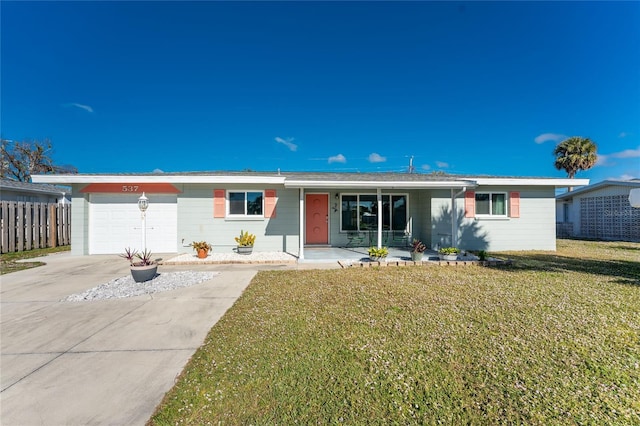 single story home featuring an attached garage, covered porch, fence, concrete driveway, and a front yard