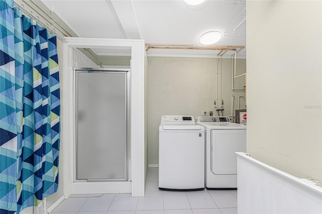 washroom with laundry area, independent washer and dryer, and tile patterned flooring