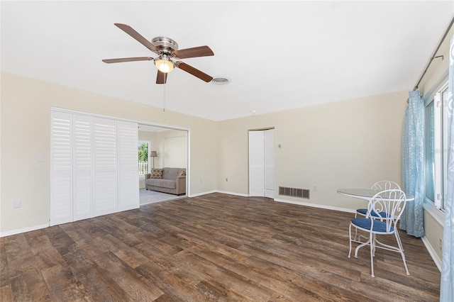 interior space featuring visible vents, plenty of natural light, and wood finished floors