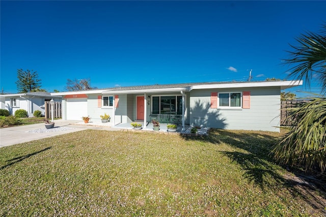 single story home featuring a garage, a porch, concrete driveway, and a front yard