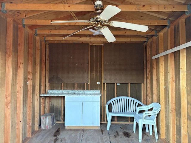 interior space featuring a ceiling fan