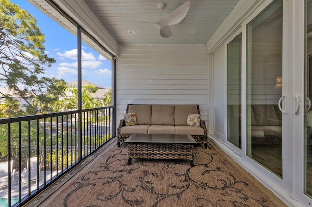 sunroom with a ceiling fan