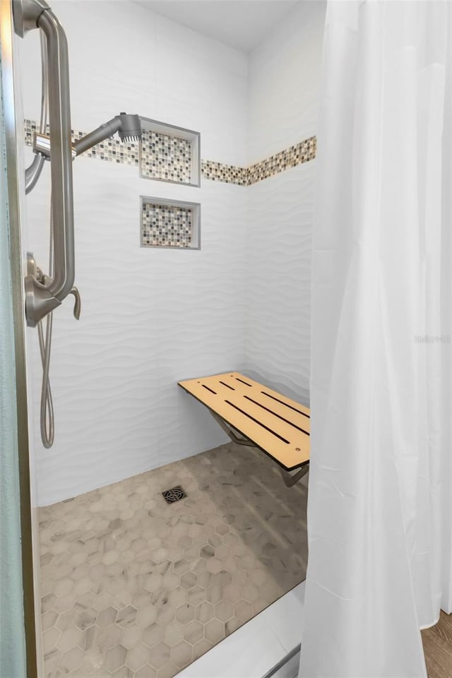 bathroom featuring a shower stall