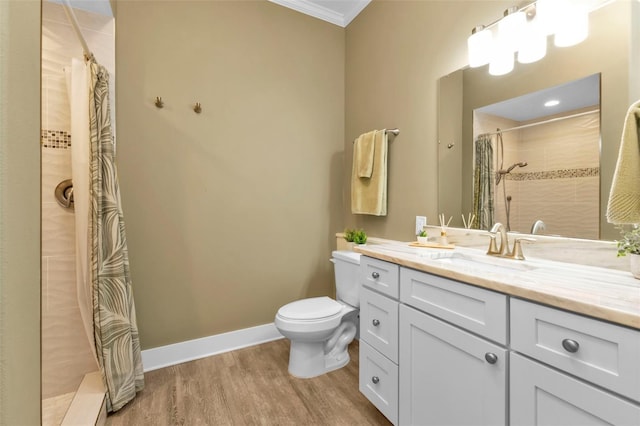 full bathroom with toilet, wood finished floors, vanity, baseboards, and tiled shower