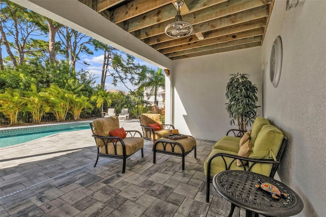 view of patio featuring a fenced in pool and outdoor lounge area