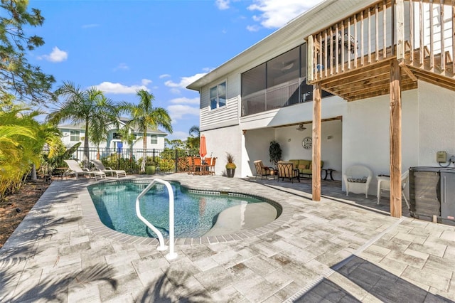 view of swimming pool featuring a patio area, fence, and a fenced in pool