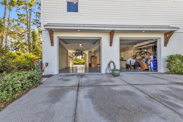 garage with concrete driveway