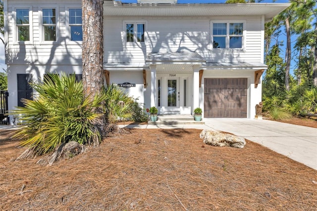 view of front facade with a garage and driveway