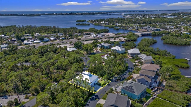 bird's eye view featuring a water view and a residential view