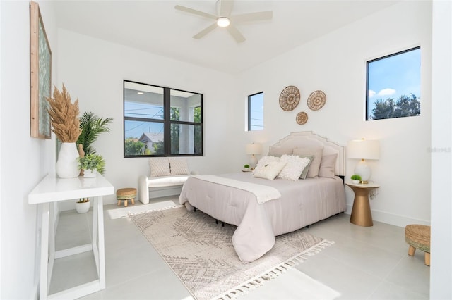 bedroom featuring ceiling fan and light tile patterned flooring