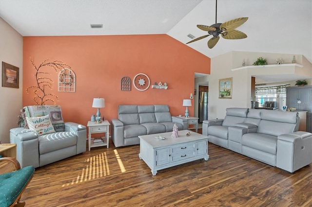 living room with ceiling fan, high vaulted ceiling, and dark wood-type flooring