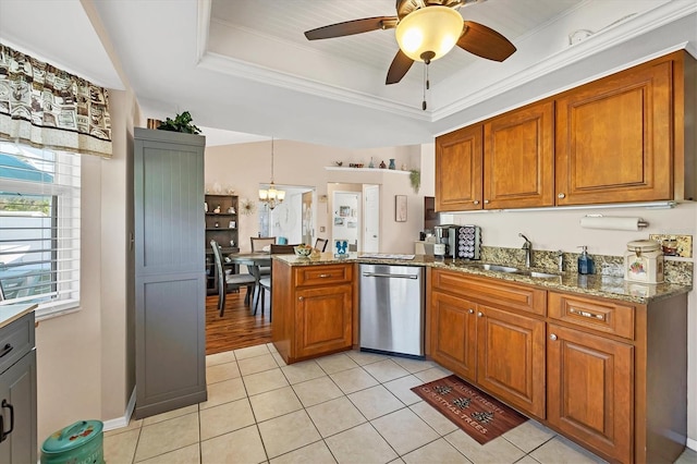 kitchen featuring dishwasher, a raised ceiling, crown molding, sink, and kitchen peninsula