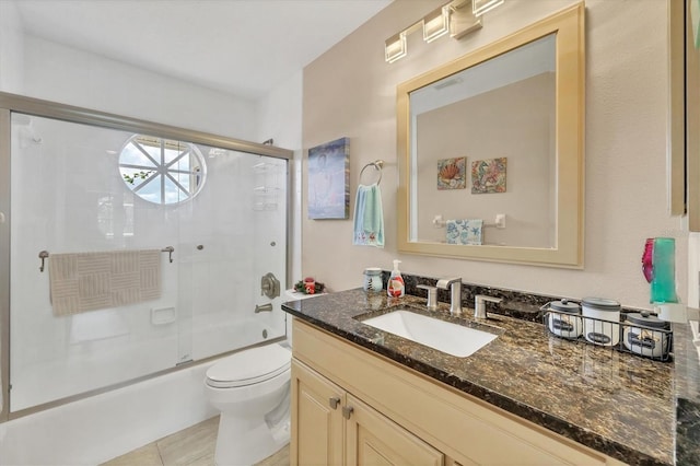 full bathroom with vanity, shower / bath combination with glass door, and toilet