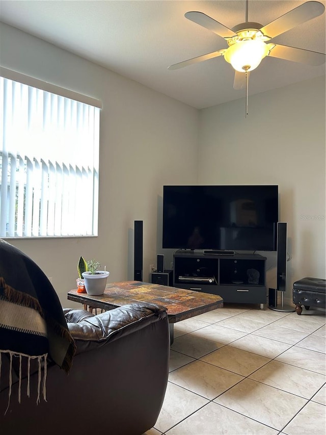 tiled living room with ceiling fan