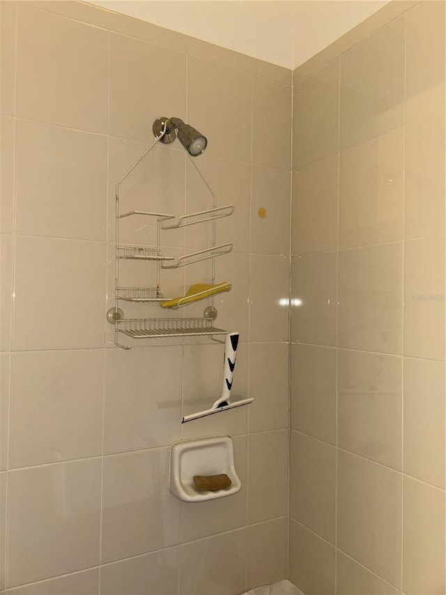 bathroom with a tile shower