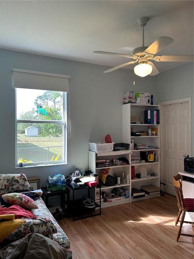 bedroom featuring light wood-type flooring and ceiling fan