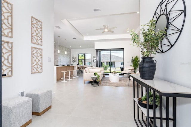 6192 Kambach St, Port Charlotte, FL 33981 - corridor with a raised ceiling, light tile patterned flooring, and recessed lighting