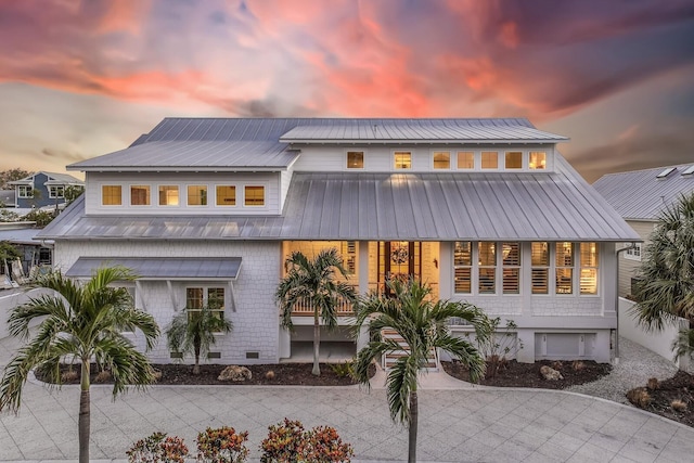 view of back house at dusk