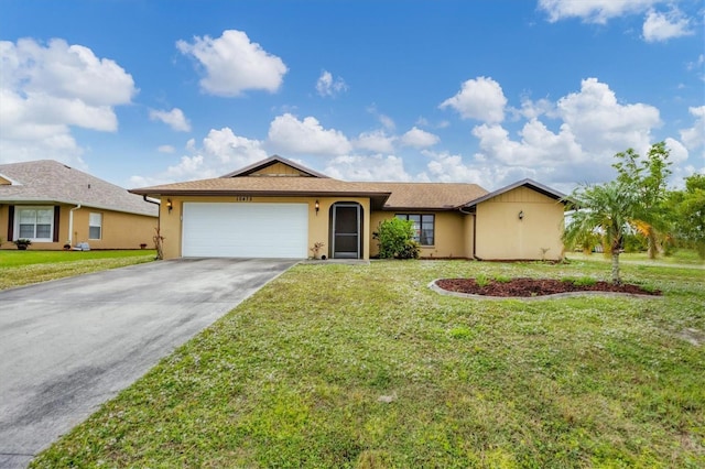 single story home with a garage and a front lawn