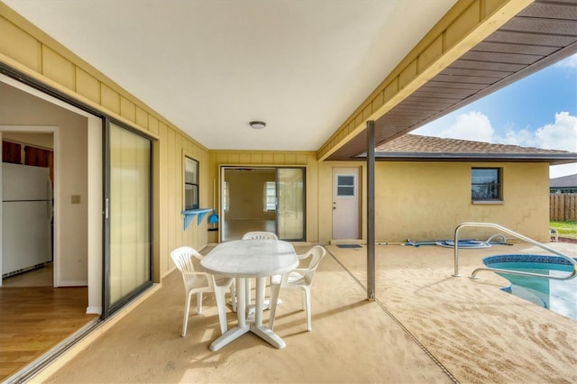 view of patio / terrace featuring a pool