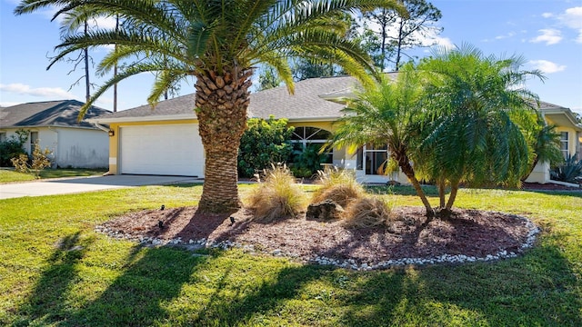 view of front of house featuring a garage and a front yard