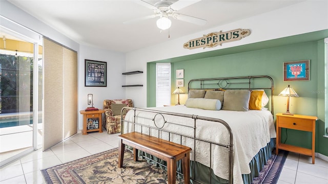 tiled bedroom featuring ceiling fan and access to outside