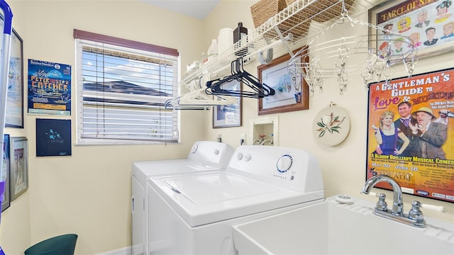 laundry room with washing machine and clothes dryer and sink