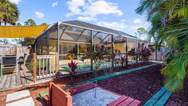 exterior space with a lanai, a fenced in pool, and a patio